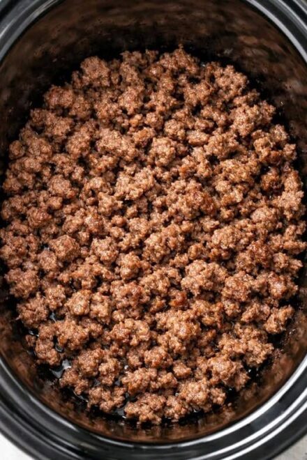 Throw browned ground beef in the slow cooker and 5 canned ingredients, and get a soup so delicious your husband will eat three bowls.