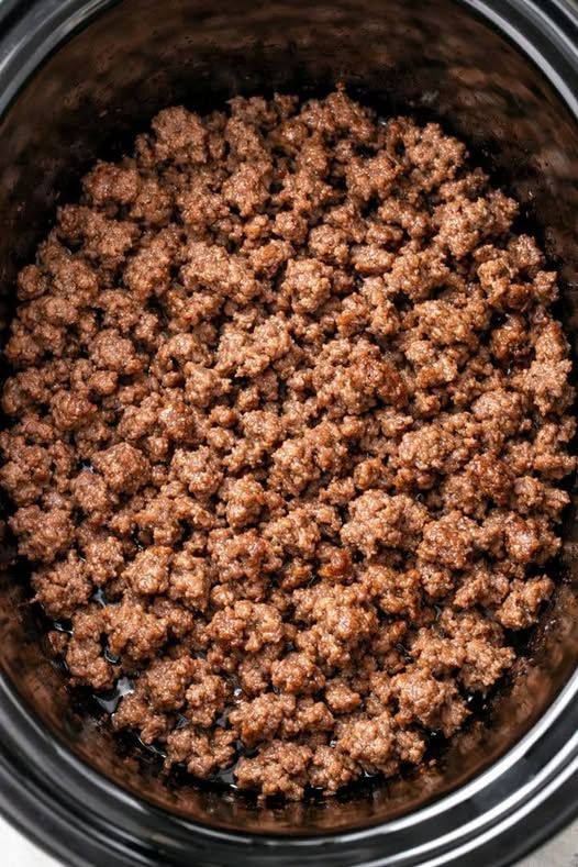 Throw browned ground beef in the slow cooker and 5 canned ingredients, and get a soup so delicious your husband will eat three bowls.