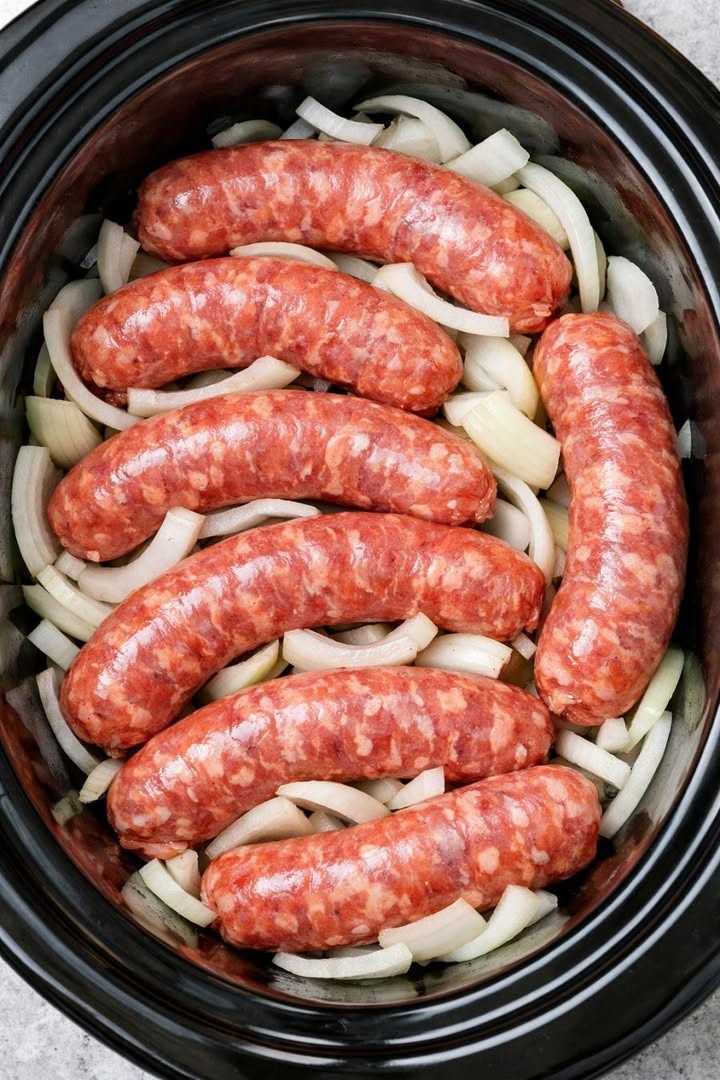 Put raw sausage links in the slow cooker with just a few add-ins and let it do its thing all afternoon.